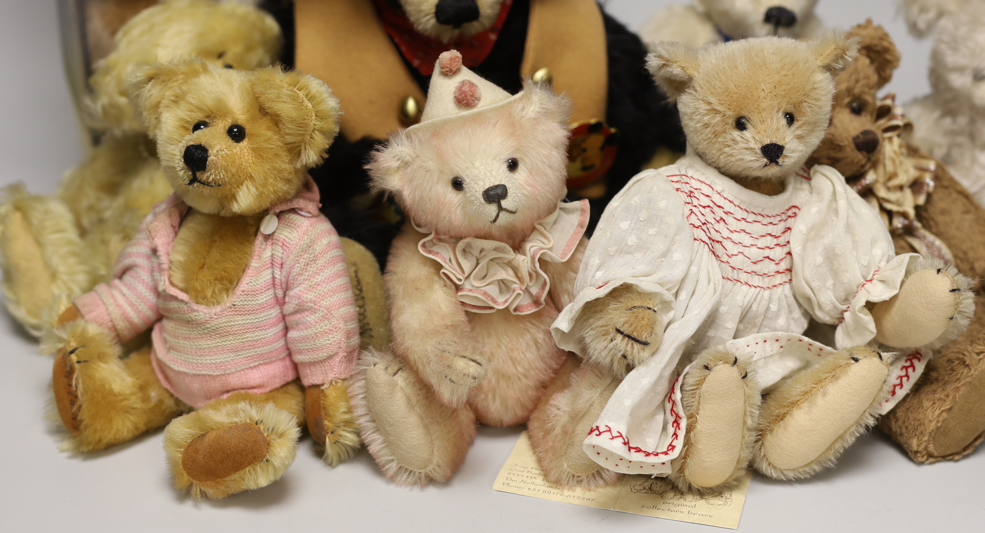 A Merrythought teddy and golly, boxed, with five artist's bears